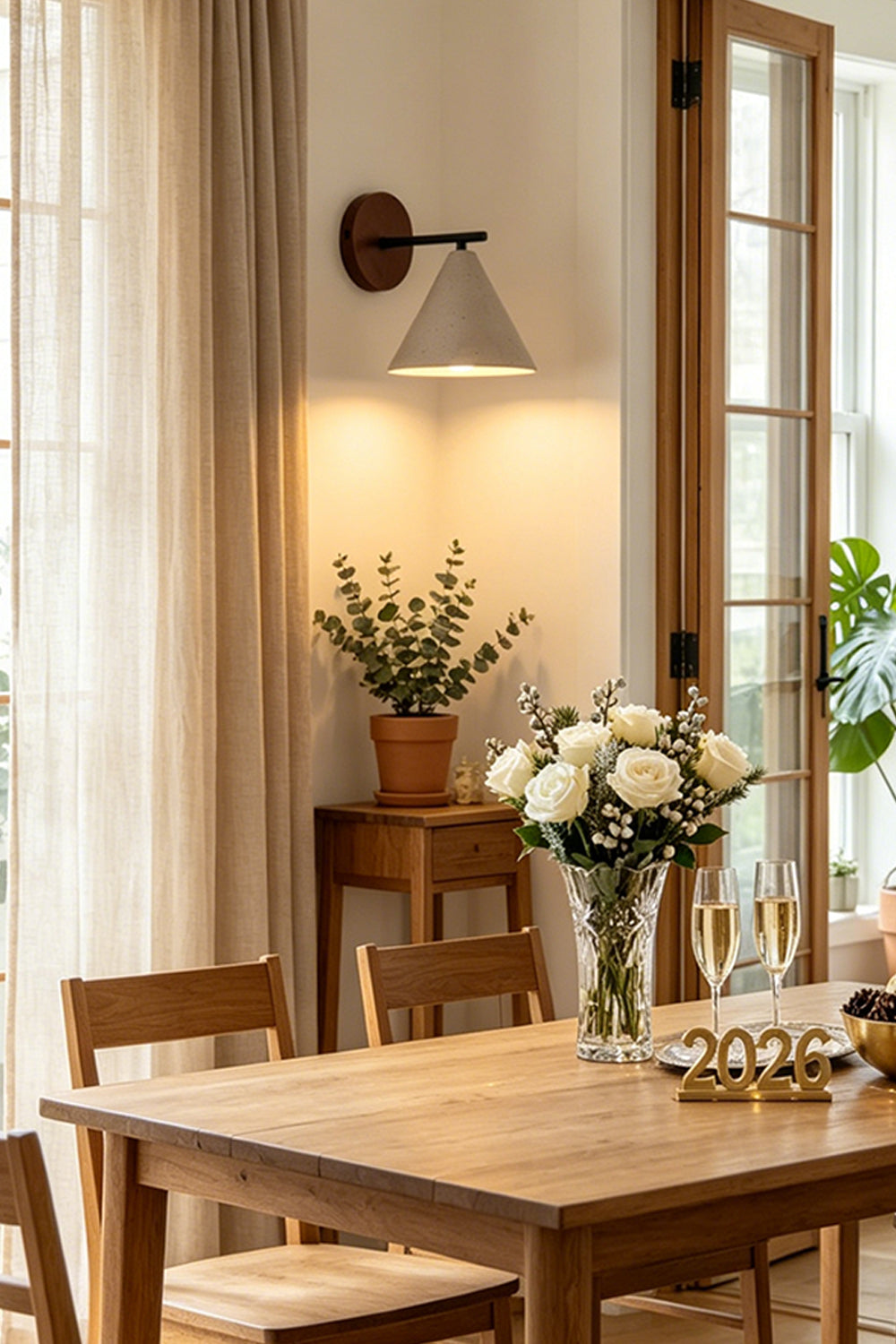Vesper Cone Travertine Wall Light | Travertine, Wood | Dining area with wooden table and plants | Samu Lamp