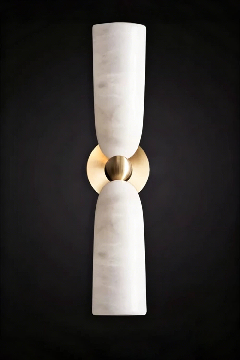 Vesperal Axis Alabaster Wall Lamp | Alabaster, Metal | Fully lit lamp showing the natural stone translucency against a dark dramatic background | Isolated product shot | Samu Lamp
