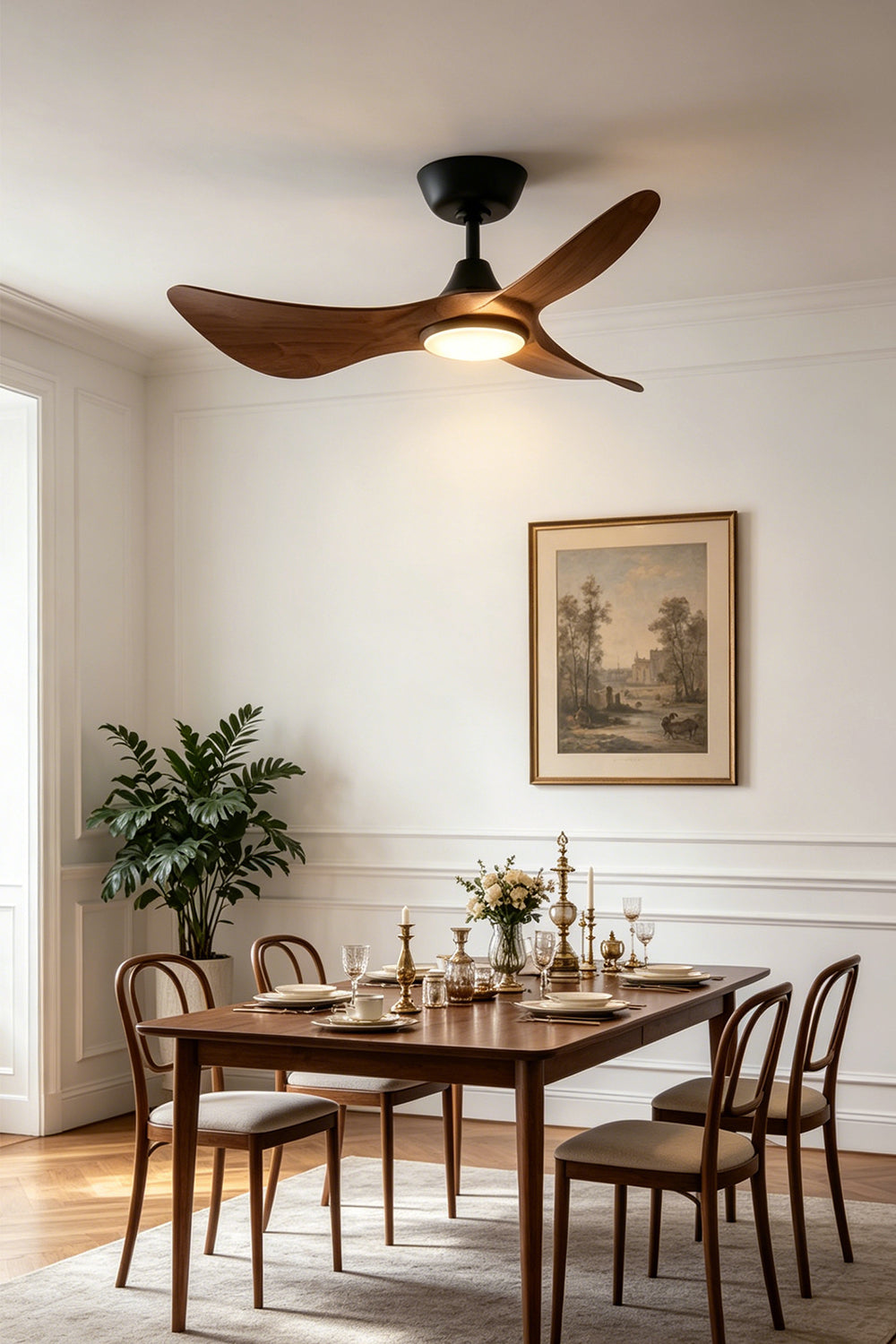Volant Sculptural Wood Ceiling Fan Light | Wood, Metal | Wide-angle room shot of the elegant sculptural wood fan illuminating a classical dining room with a long wooden table and chairs | Samu Lamp