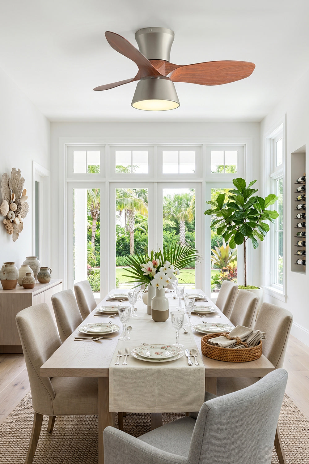 Volos Modern Minimalist Ceiling Fan Light | Wood, Metal | Wide-angle view of the elegant ceiling fan fixture illuminating a spacious minimalist dining space overlooking a lush green garden | Samu Lamp