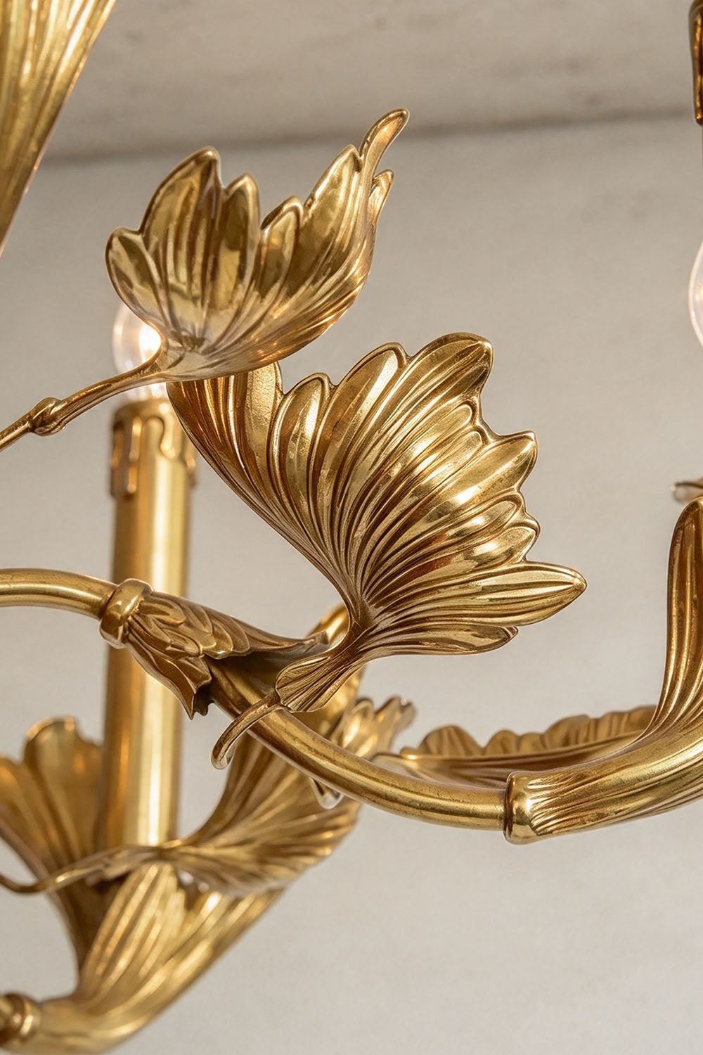 Vrilette Brass Leaf Vine Candle Chandelier | Carved Brass | Macro detail shot of the sculpted brass leaf bobeches and candle sockets | Samu Lamp