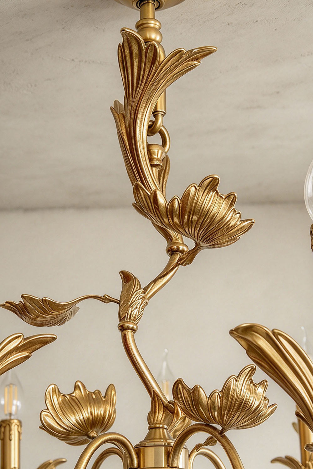 Vrilette Brass Leaf Vine Candle Chandelier | Carved Brass | Close-up detail of the climbing brass vine and acanthus leaf central stem | Samu Lamp