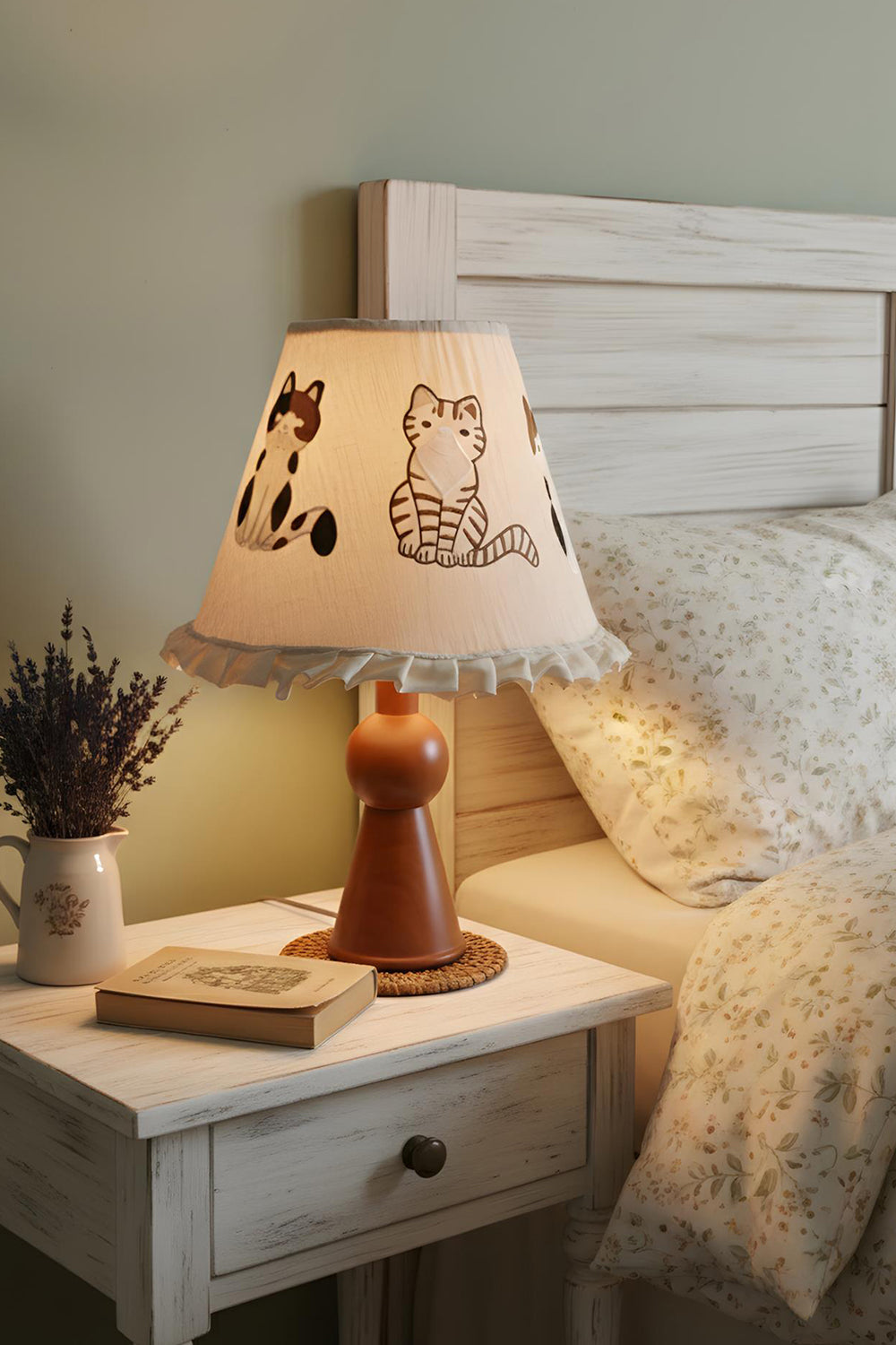 Whiskers Ruffled Fabric Table Lamp | Fabric, Wood | Set on a white rustic wooden nightstand casting a warm bedroom glow next to a classical paneled headboard bed | Samu Lamp