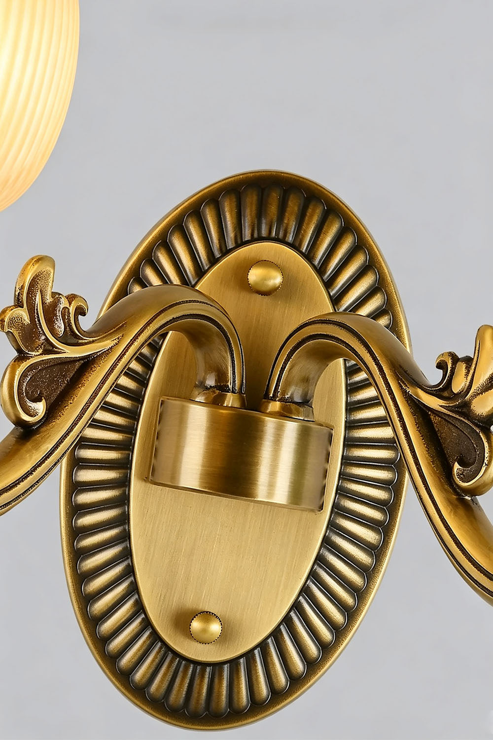 Whitlock Fluted Bell Brass Wall Lamp close-up of ornate brass mount and elegant design.