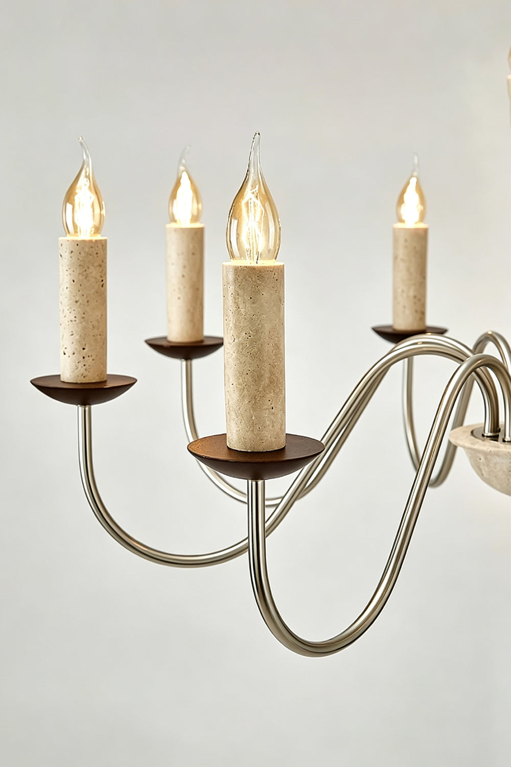 Winslow Travertine Candelabra Chandelier | Natural Travertine and Metal | Side close-up highlighting candle bulbs and brass bobeches | Samu Lamp