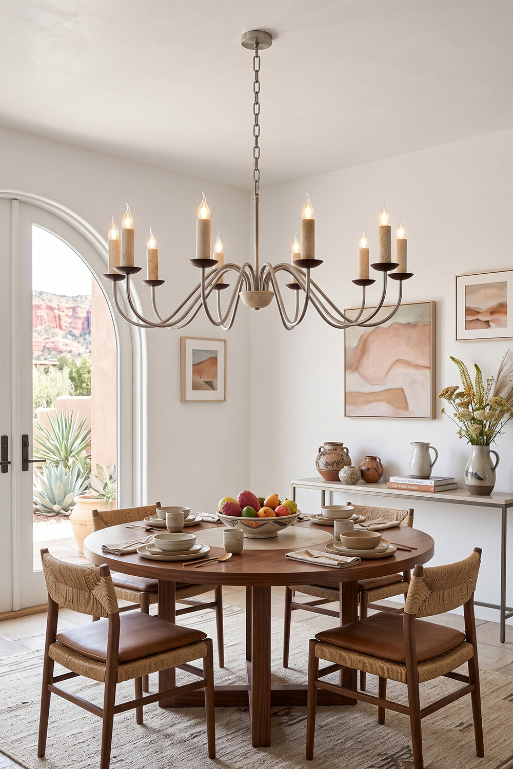 Winslow Travertine Candelabra Chandelier | Natural Travertine and Metal | Hanging above a round wooden table in a bright dining room | Samu Lamp