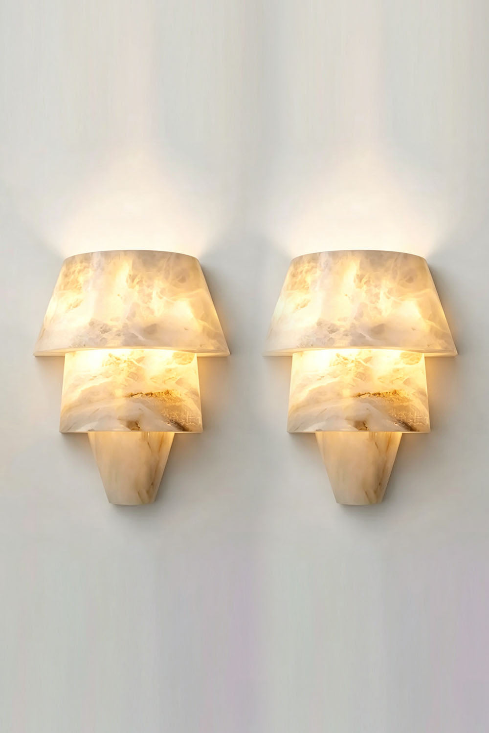 Wystan Twin Cone Alabaster Wall Lamp | Natural Alabaster and Metal | Studio display of a pair of alabaster wall lamps mounted side-by-side | Samu Lamp