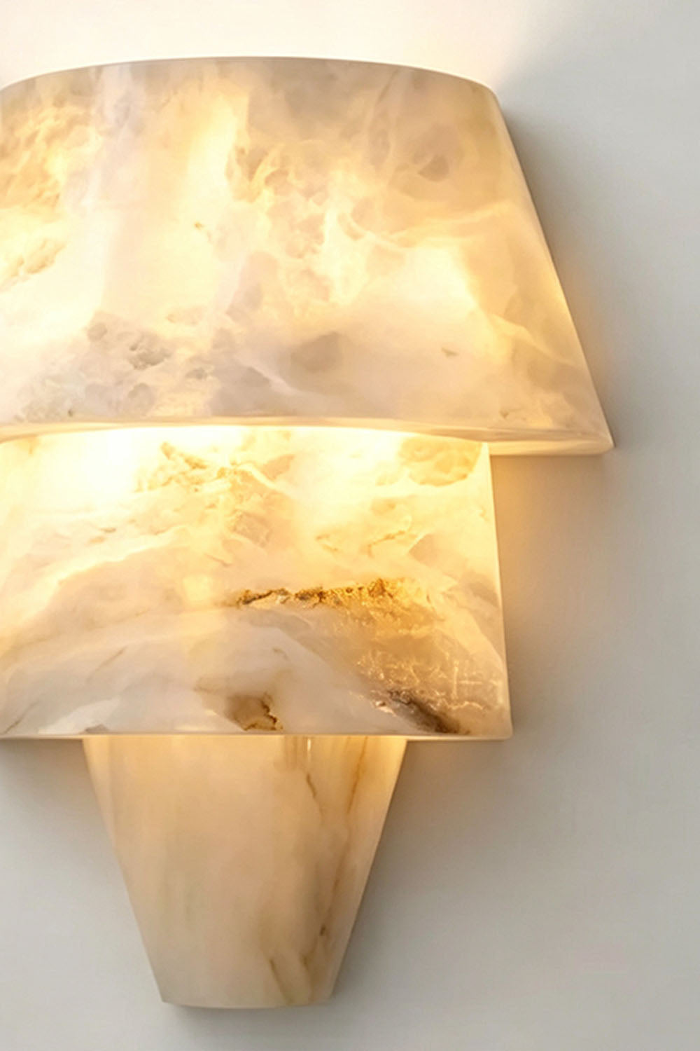 Wystan Twin Cone Alabaster Wall Lamp | Natural Alabaster and Metal | Detail shot showing the translucent natural veined stone shade profile | Samu Lamp