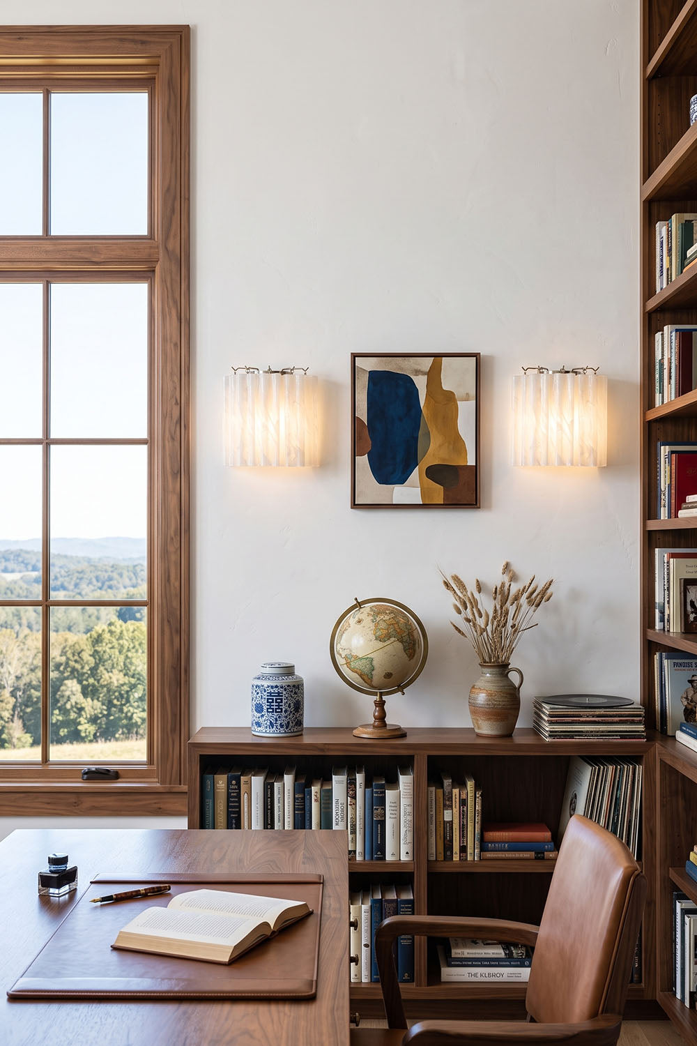 Ysoline Rippled Glass Curtain Sconce Light | Rippled Glass and Metal | Displayed on a bright wall in a home office near a wooden desk | Samu Lamp